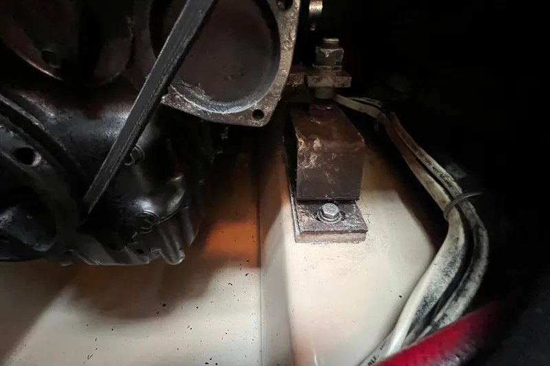 Slide: The Image of Engine compartment of a 1994 Island Packet 44 cutter, showing motor mount and cables. - 112