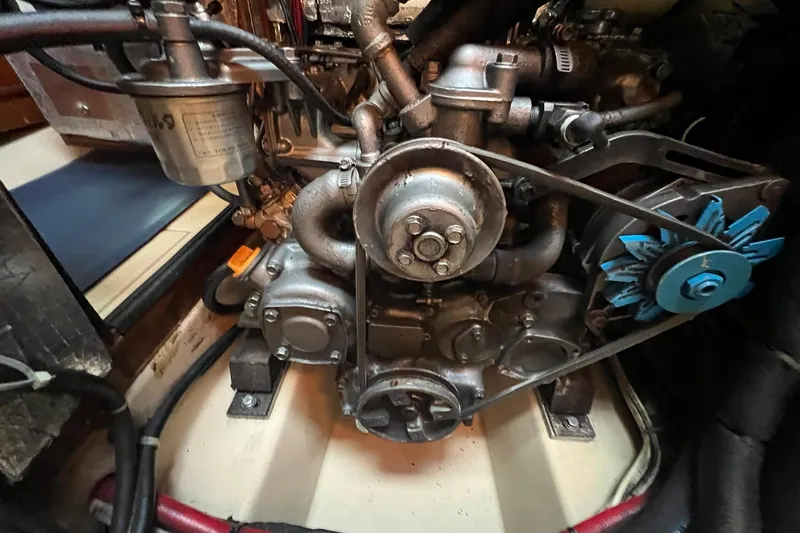 Slide: The Image of Engine of a 1994 Island Packet 44 cutter sailboat, showcasing mechanical components. - 115