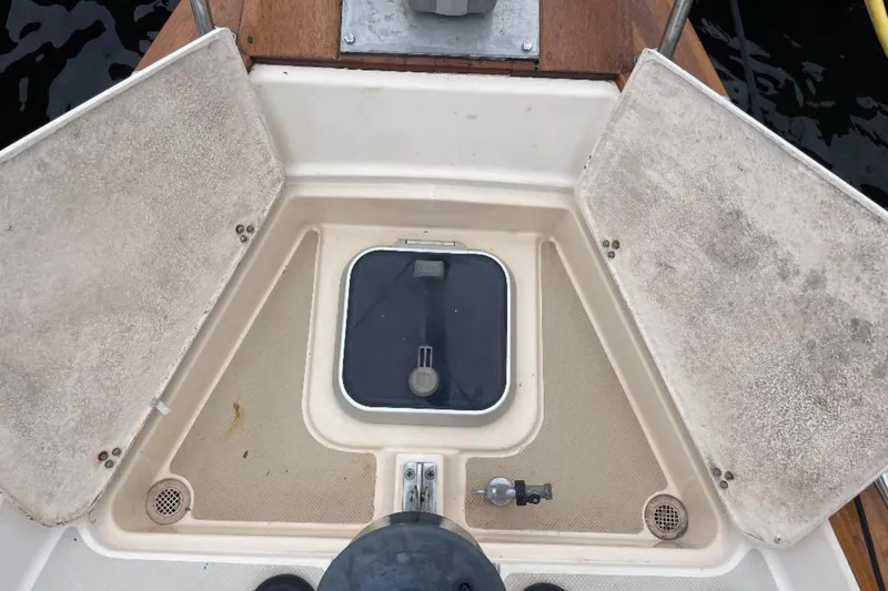 Slide: The Image of Cockpit of 1994 Island Packet 44 cutter sailboat with storage compartments open. - 31