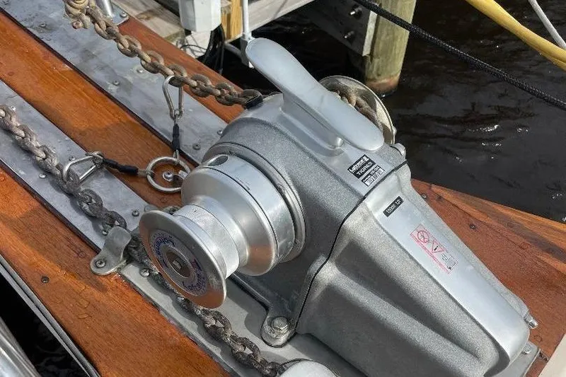 Slide: The Image of Anchor windlass on 1994 Island Packet 44 cutter sailboat deck. - 55