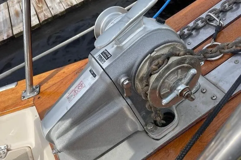 Slide: The Image of Anchor winch on 1994 Island Packet 44 cutter sailboat deck. - 56