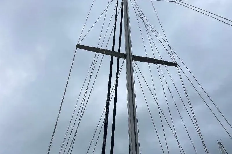 Slide: The Image of Mast and rigging of 1994 Island Packet 44 cutter sailboat against cloudy sky. - 6
