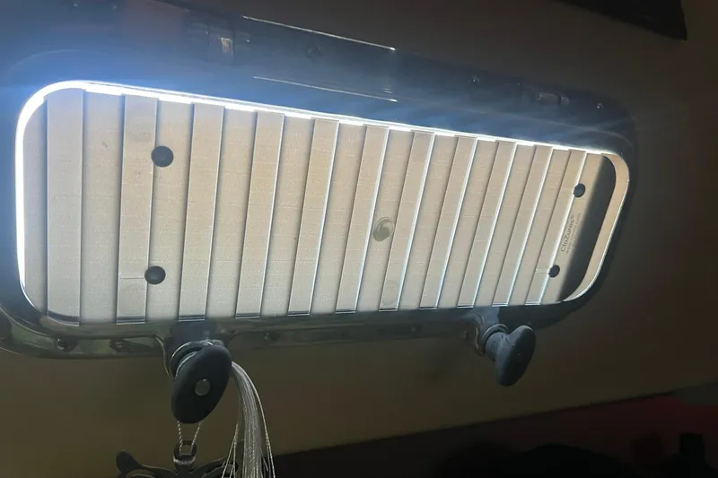 Slide: The Image of Interior view of a 1994 Island Packet 44 cutter sailboat window with blinds. - 92