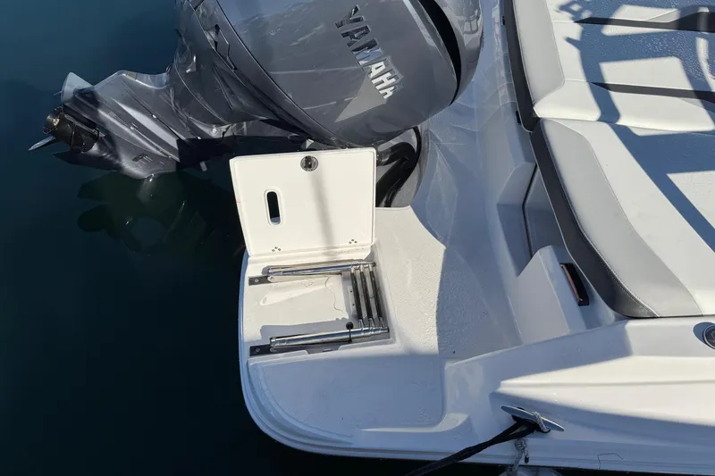 Slide: The Image of 2026 Regal 21 OBX boat with Yamaha outboard motor and swim platform. - 11