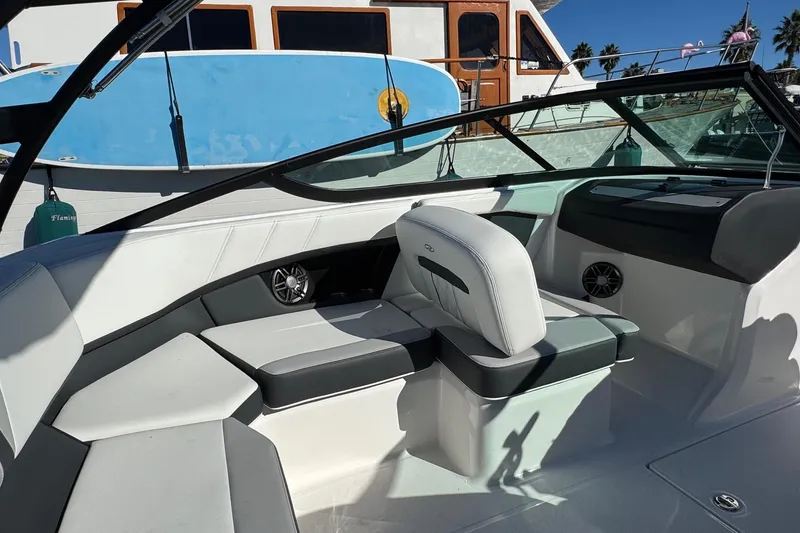 Slide: The Image of 2026 Regal 21 OBX boat interior with sleek seating and modern design. - 23