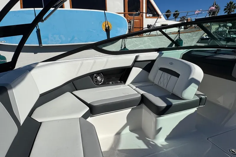 Slide: The Image of Interior of 2026 Regal 21 OBX boat with stylish seating and modern design. - 24