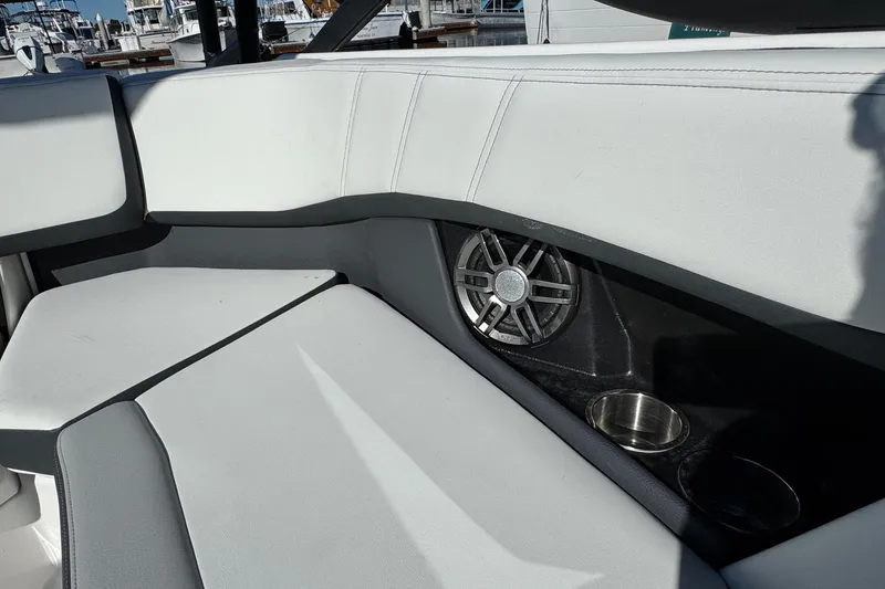 Slide: The Image of Interior of 2026 Regal 21 OBX boat with speaker and cup holders. - 27