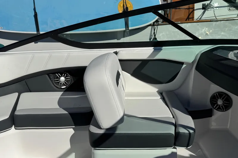 Slide: The Image of Interior of 2026 Regal 21 OBX boat with modern seating and speaker system. - 28