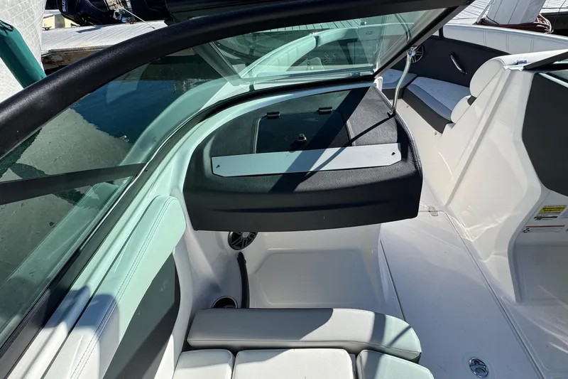 Slide: The Image of Interior view of 2026 Regal 21 OBX boat, featuring seating and dashboard. - 30