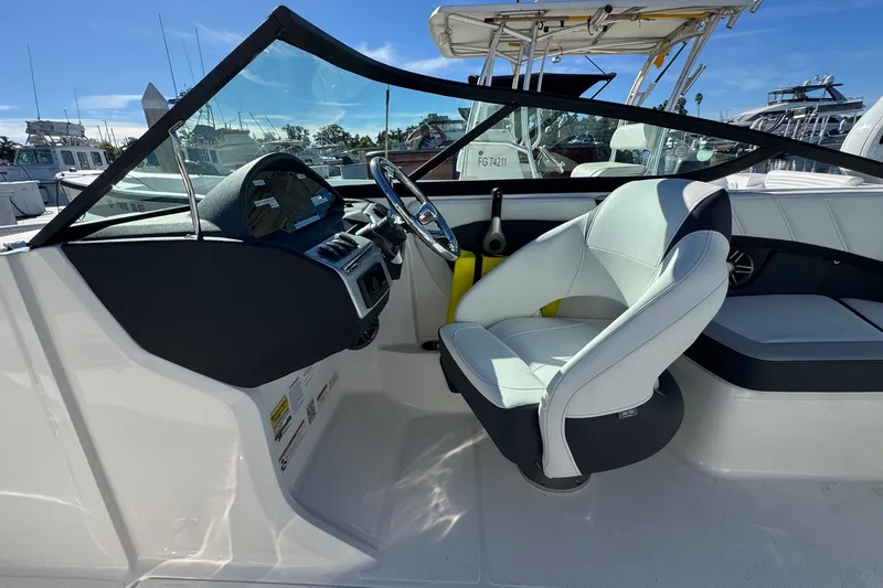 Slide: The Image of 2026 Regal 21 OBX boat interior with modern helm and comfortable seating. - 32