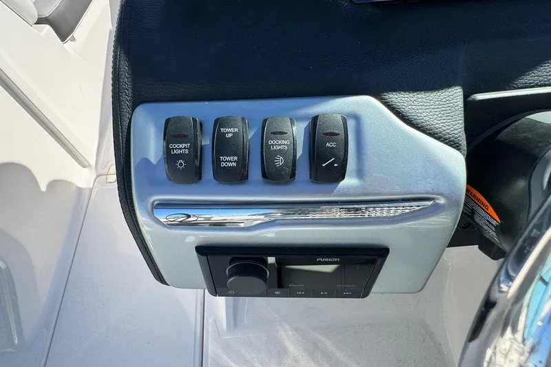 Slide: The Image of Control panel of 2026 Regal 21 OBX boat with labeled switches and audio system. - 37
