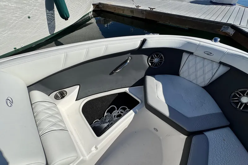 Slide: The Image of Interior of 2026 Regal 21 OBX boat with white and gray seating. - 48