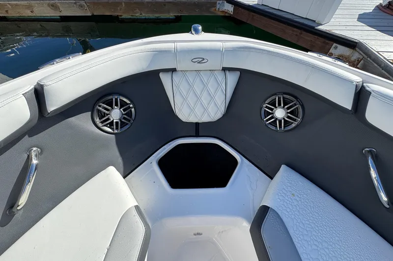Slide: The Image of Interior of 2026 Regal 21 OBX boat with speakers and seating. - 49
