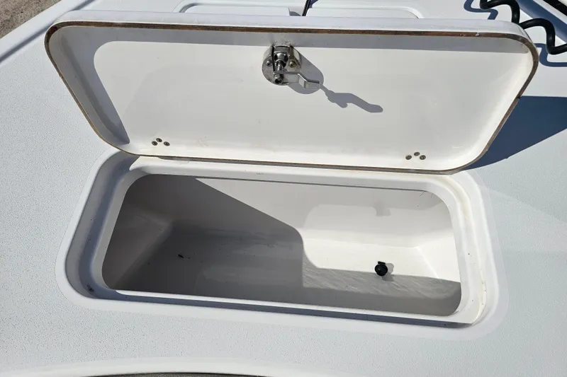 Slide: The Image of Open storage compartment on 2021 Sportsman Masters 267OE Bay Boat. - 11