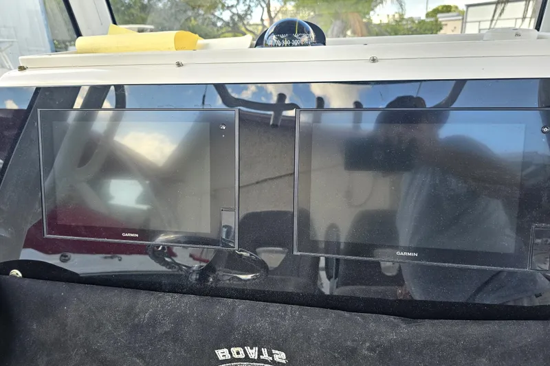 Slide: The Image of Dashboard of 2021 Sportsman Masters 267OE Bay Boat with dual Garmin displays. - 18