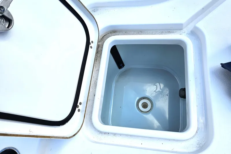 Slide: The Image of Open storage compartment on 2021 Sportsman Masters 267OE Bay Boat. - 24
