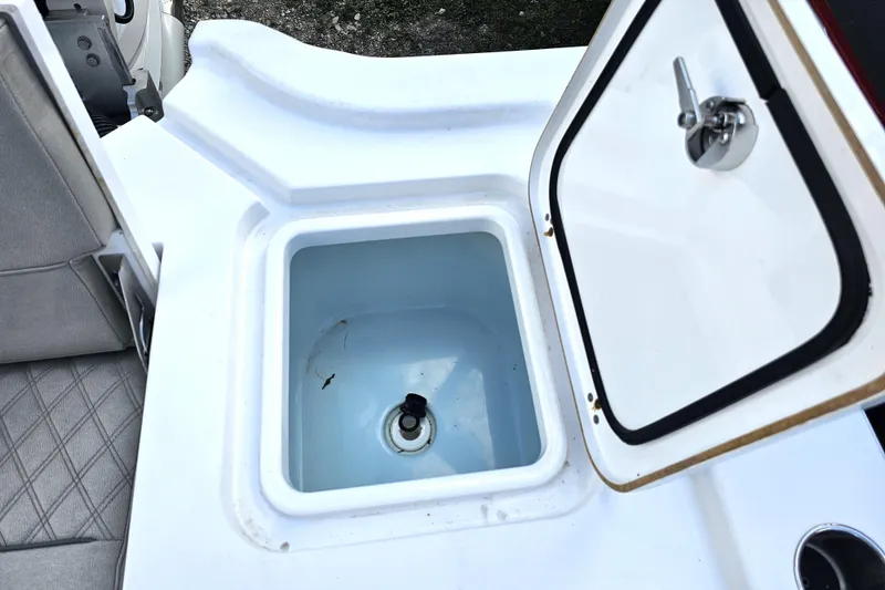Slide: The Image of Open storage compartment on 2021 Sportsman Masters 267OE Bay Boat. - 25