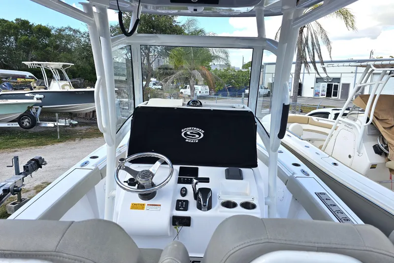 Slide: The Image of 2021 Sportsman Masters 267OE Bay Boat interior with steering console and seating. - 28