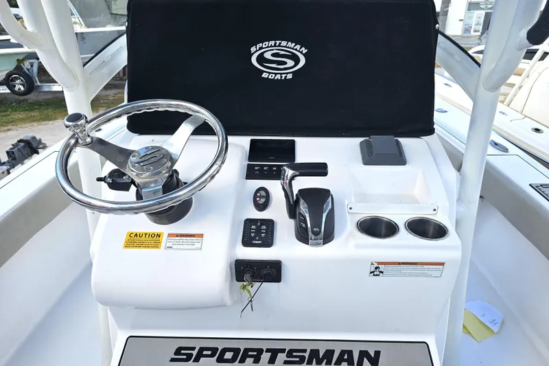 Slide: The Image of 2021 Sportsman Masters 267OE Bay Boat helm with steering wheel and controls. - 29