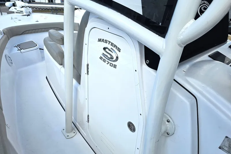 Slide: The Image of 2021 Sportsman Masters 267OE Bay Boat interior with seating and console details. - 30