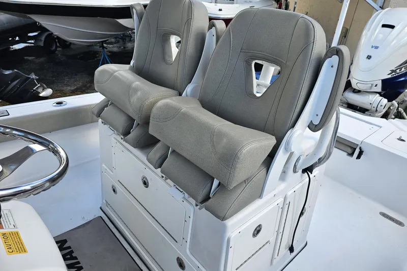 Slide: The Image of 2021 Sportsman Masters 267OE Bay Boat with dual cushioned seats and steering wheel. - 31