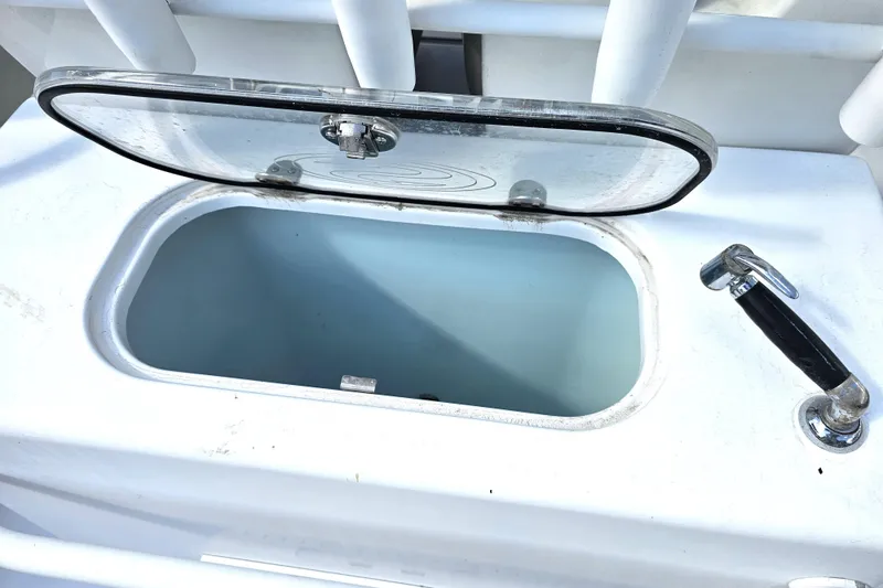 Slide: The Image of Open storage compartment on 2021 Sportsman Masters 267OE Bay Boat. - 32