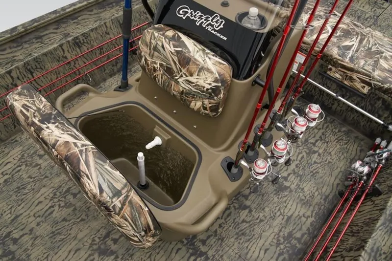 Slide: The Image of 2026 Tracker Grizzly 1860 Center Console with camo seats and fishing rod holders. - 10