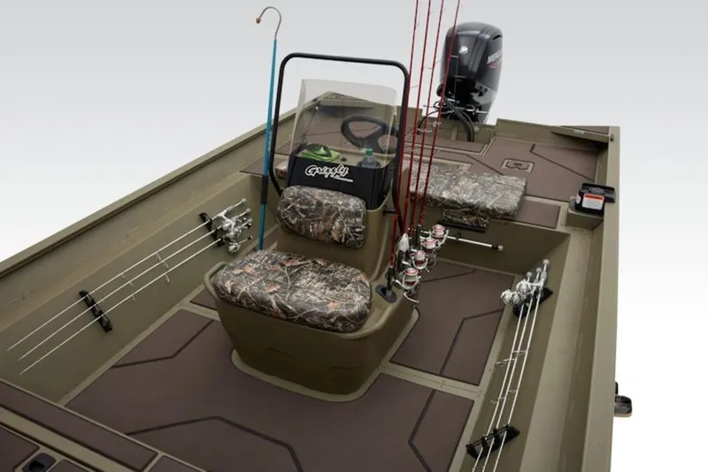Slide: The Image of 2026 Tracker Grizzly 2072 Center Console boat with camo seats and fishing rods. - 8