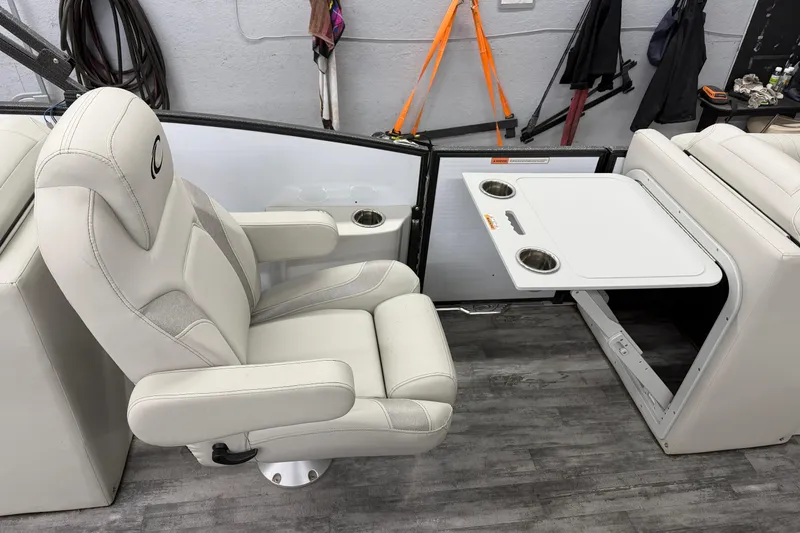 Slide: The Image of 2021 Crest Caribbean LX 230 SLC boat interior with plush seating and modern design. - 12