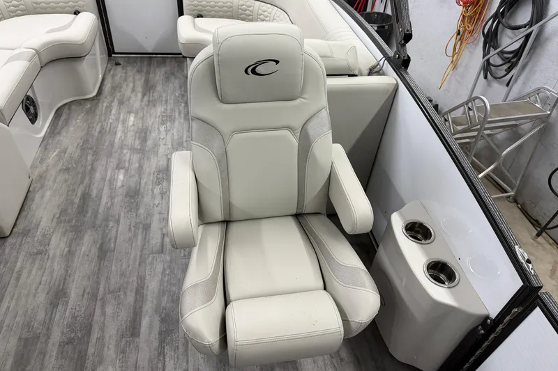 Slide: The Image of Luxurious seating and table setup in 2021 Crest Caribbean LX 230 SLC boat interior. - 13