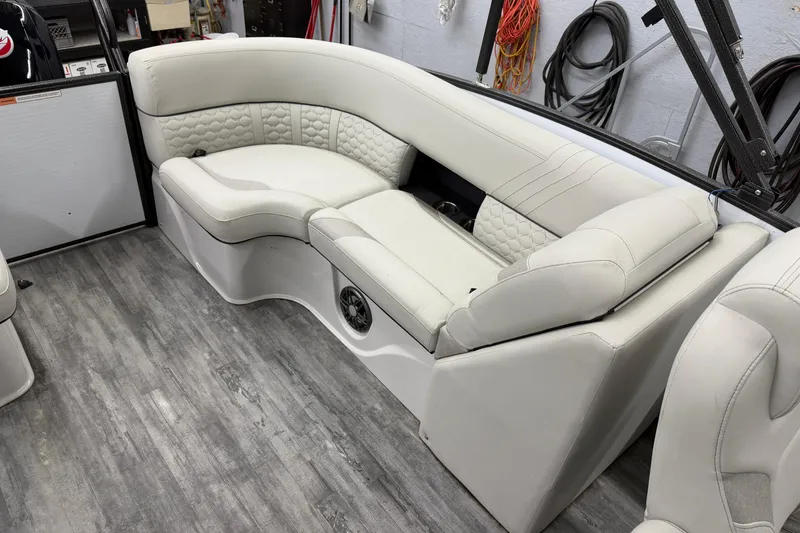 Slide: The Image of 2021 Crest Caribbean LX 230 SLC boat interior with luxurious seating and cup holders. - 14