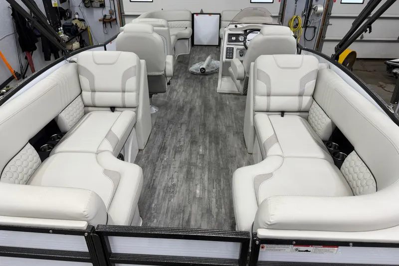 Slide: The Image of 2021 Crest Caribbean LX 230 SLC interior with luxurious white seating and modern design. - 17