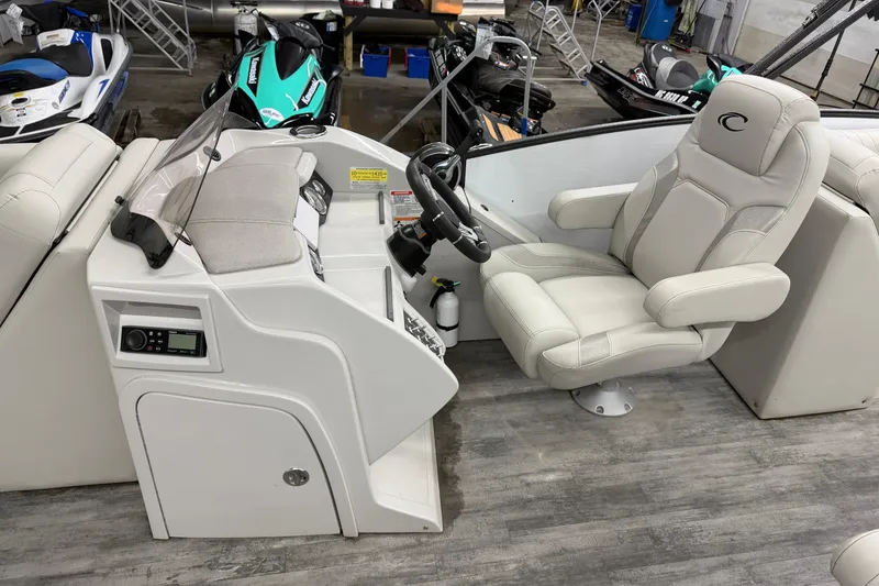 Slide: The Image of 2021 Crest Caribbean LX 230 SLC boat interior with plush seating and modern design. - 7