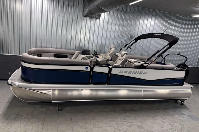 The Image of 2026 Premier 230 SunSation RF Tritoon in showroom, featuring sleek design and comfortable seating. - 0