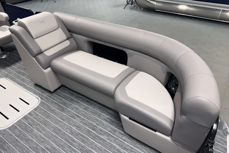 Slide: The Image of Luxurious seating on 2026 Premier 230 SunSation RF Tritoon boat, featuring sleek gray upholstery. - 13