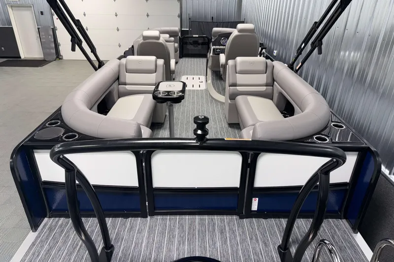 Slide: The Image of 2026 Premier 230 SunSation RF Tritoon interior with luxurious seating and modern design. - 2