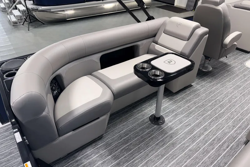 Slide: The Image of Luxurious seating in 2026 Premier 230 SunSation RF Tritoon with cup holders and modern design. - 4