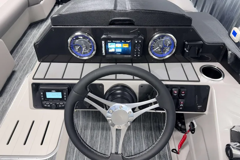 Slide: The Image of 2026 Premier 230 SunSation RF Tritoon dashboard with modern controls and steering wheel. - 6