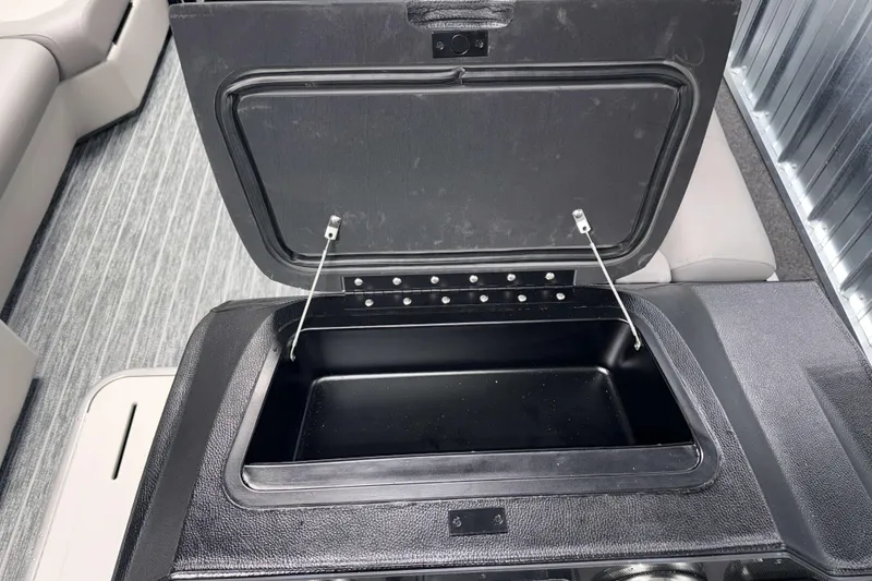Slide: The Image of Open storage compartment on 2026 Premier 230 SunSation RF Tritoon boat. - 7