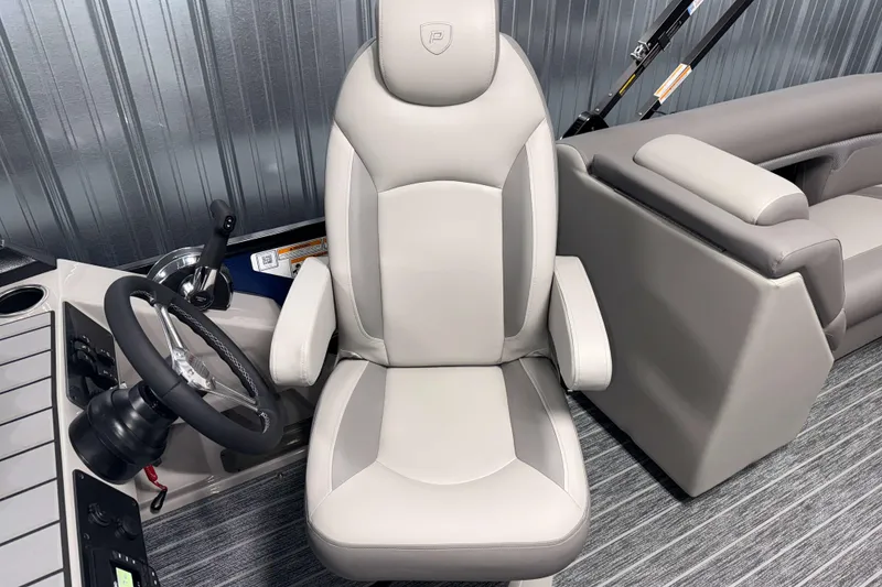 Slide: The Image of Captain's chair in 2026 Premier 230 SunSation RF Tritoon boat, featuring sleek design and comfort. - 8