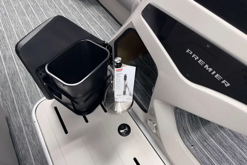 Slide: The Image of Interior of 2026 Premier 230 SunSation RF Tritoon with storage and accessories. - 9