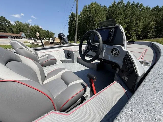 Slide: The Image of 2023 Xpress Boats H18 interior with modern dashboard and comfortable seating. - 3