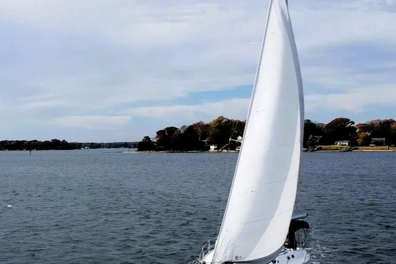 Slide: The Image of Sailing yacht Beneteau Oceanis 351, 1995 model, gliding on serene waters. - 3