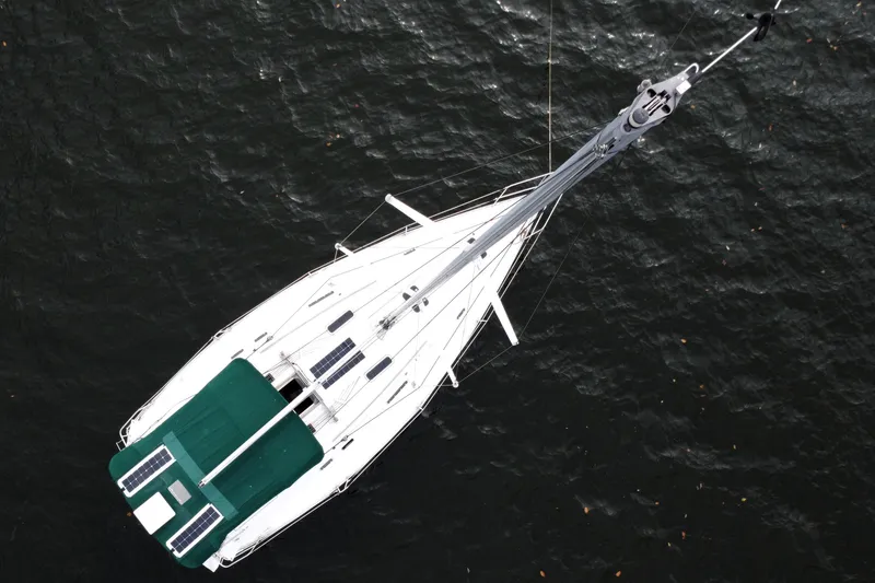 Slide: The Image of Aerial view of 1995 Beneteau Oceanis 351 sailboat on dark water. - 8