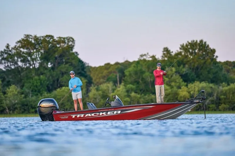 Slide: The Image of Two people fishing on a 2025 Tracker Pro Team 195 Tournament Edition boat. - 9