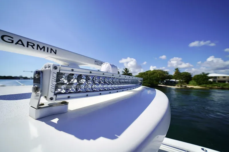 Slide: The Image of SIONYX camera on 2024 Invincible 35 Catamaran, with blurred background of palm trees and water. - 18