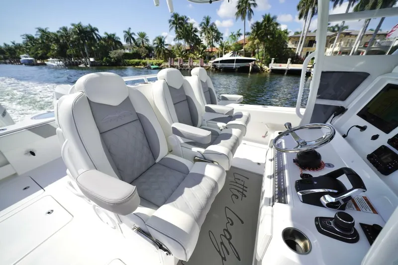 Slide: The Image of 2024 Invincible 35 Catamaran interior with luxury seating and waterfront view. - 5