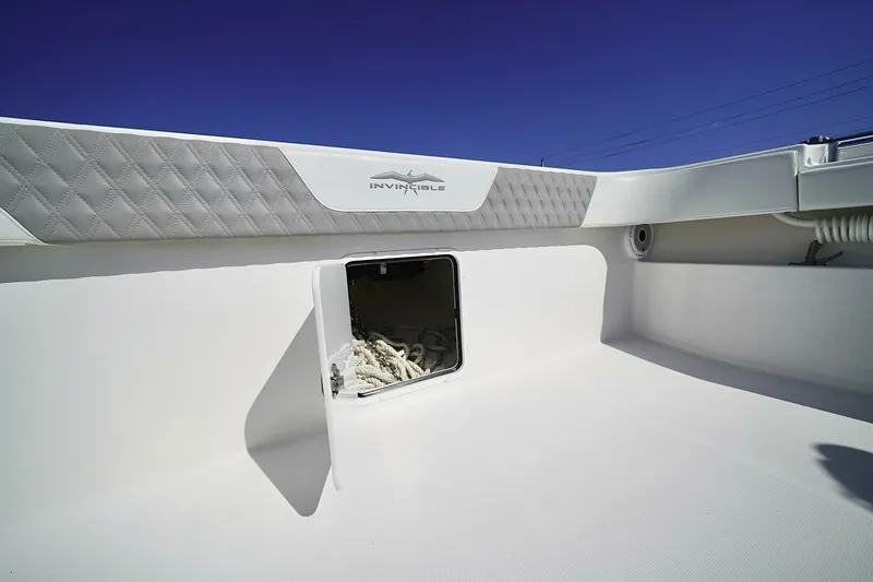Slide: The Image of Anchor compartment of 2024 Invincible 35 Catamaran with chain and winch. - 9