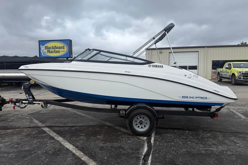 The Image of 2026 Yamaha Boats SX190 on trailer at BlackBeard Marine dealership. - 0