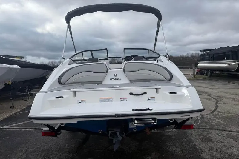 Slide: The Image of 2026 Yamaha Boats SX190, white exterior, parked outdoors under cloudy skies. - 4